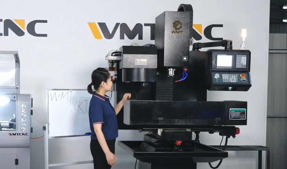 Vertical CNC Milling Machine with a woman standing nearby