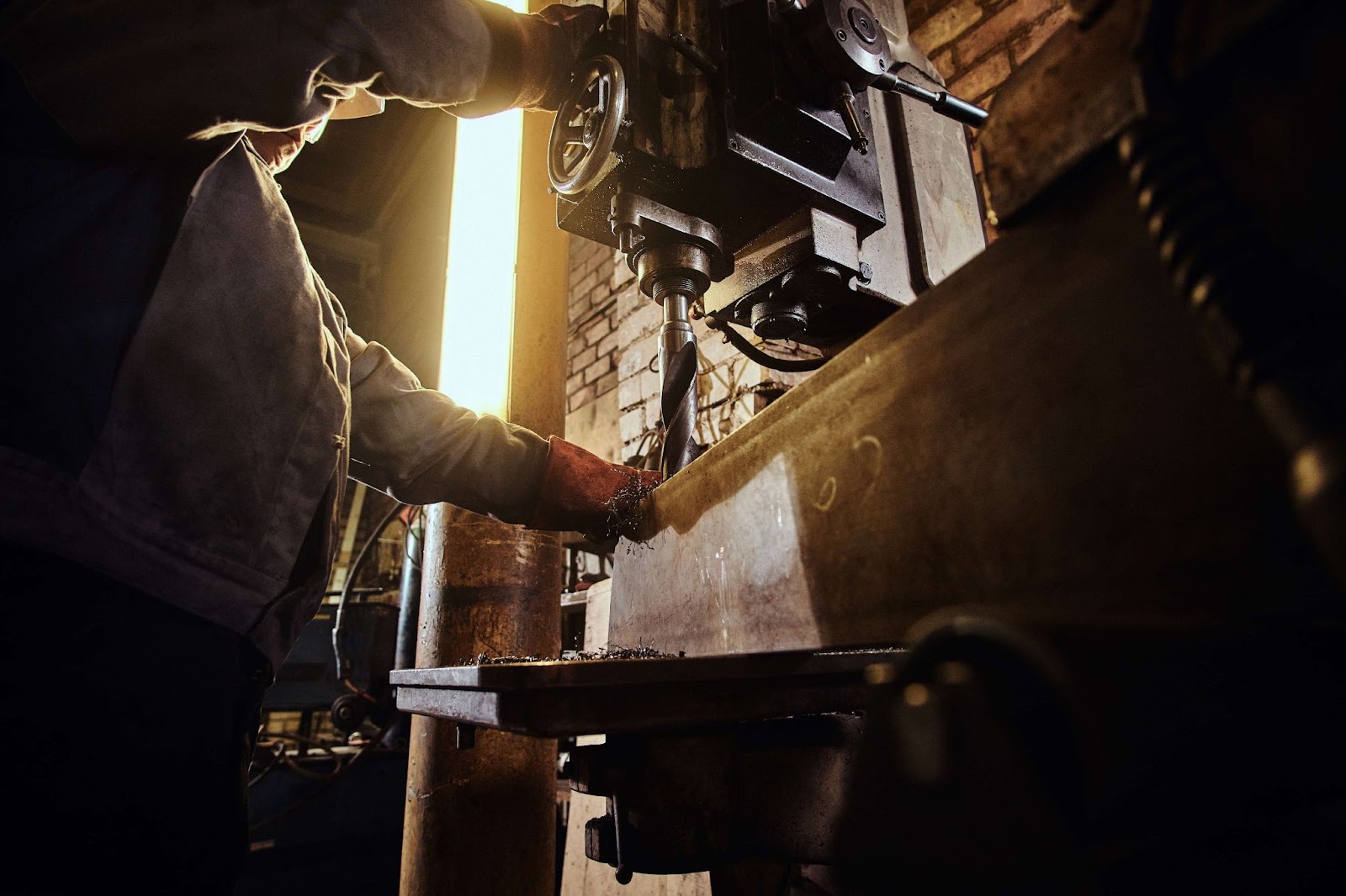 A man works at a lathe