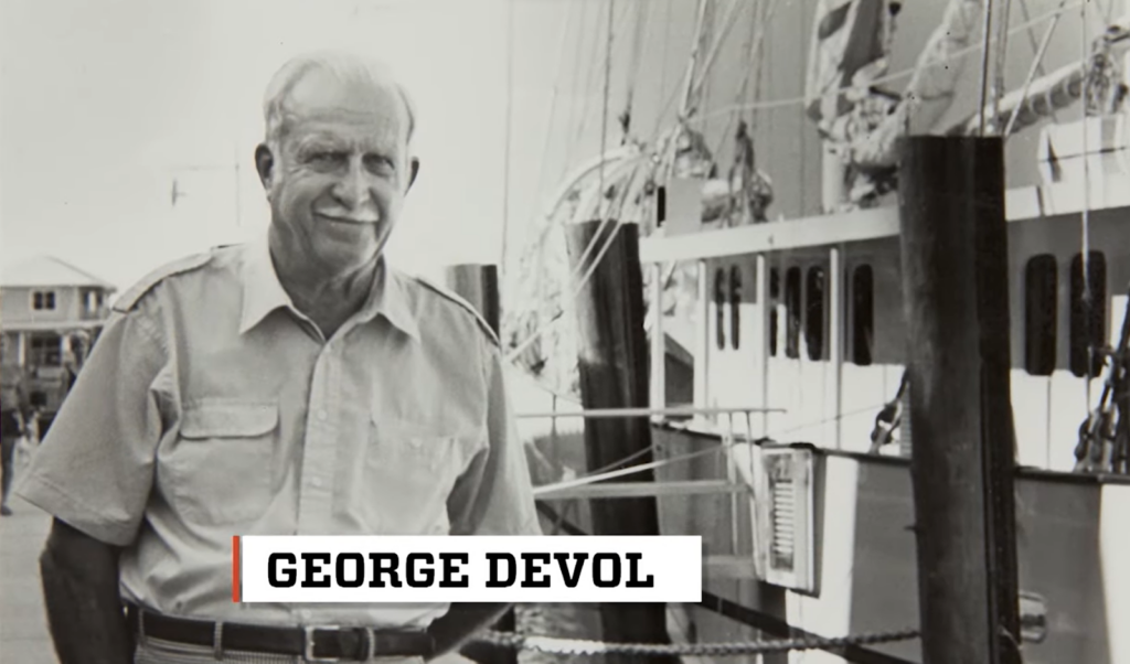 George Devol black and white photo near the ship